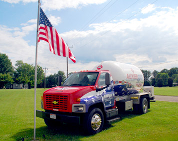 Auxier truck next to American flag