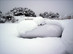 Image of propane tank under snow