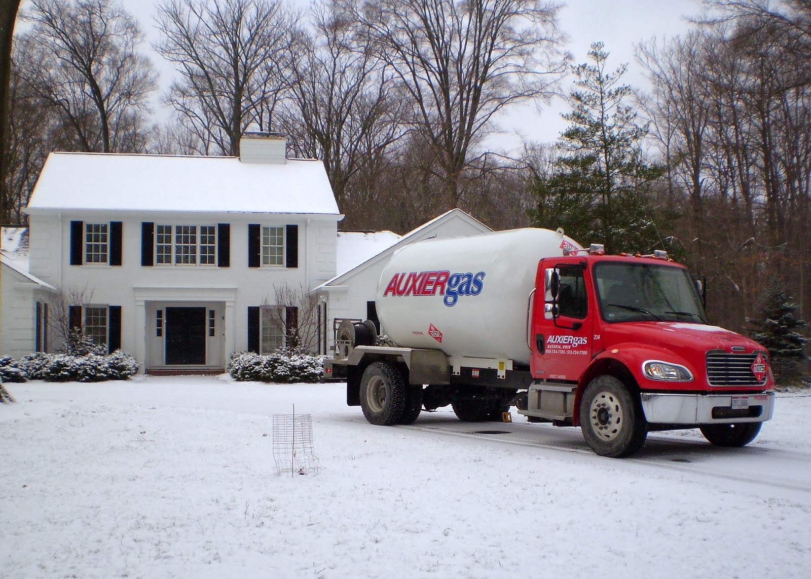 Image of Auxier Gas truck in front of house