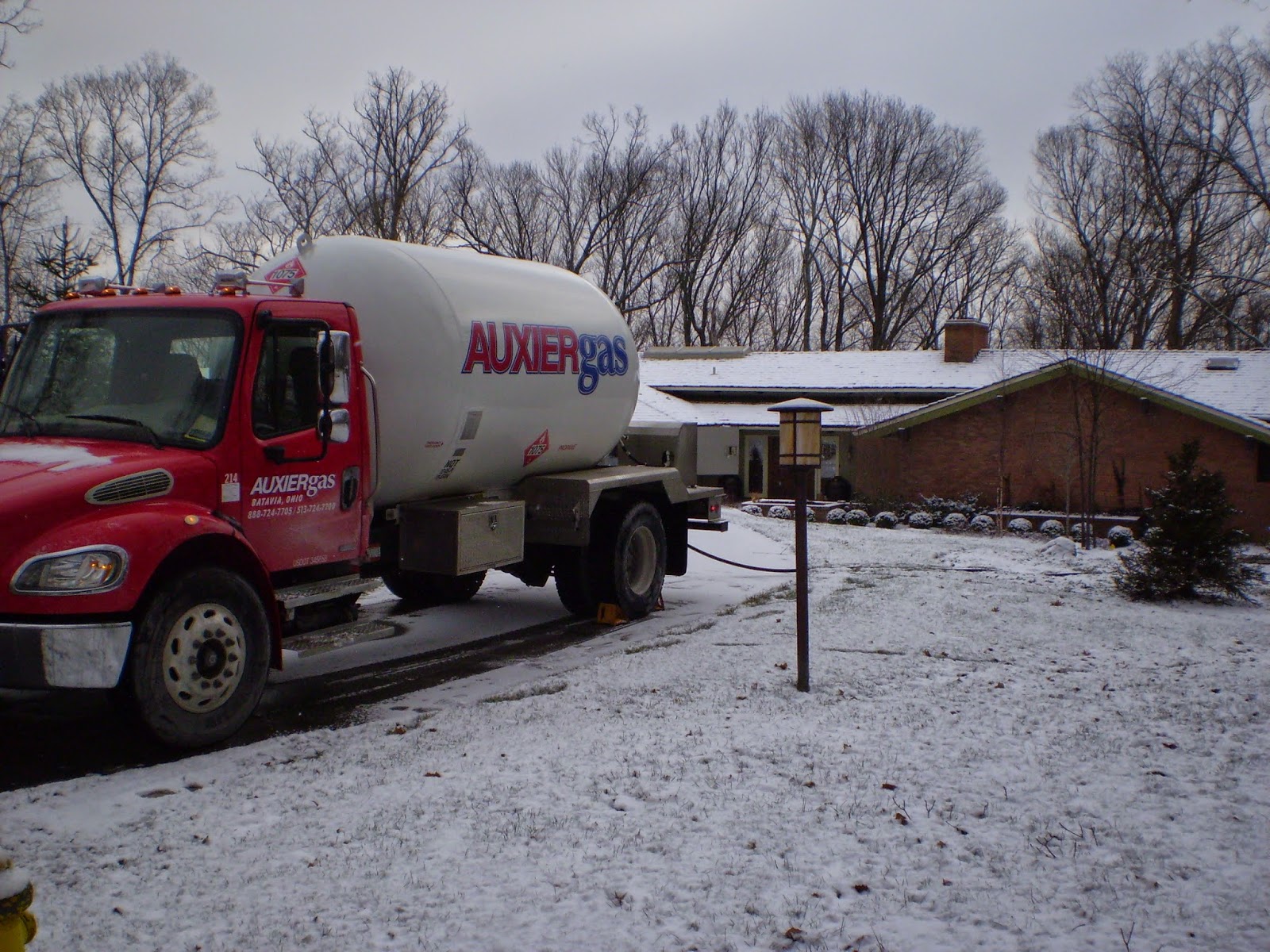 Image of Auxier Gas tank delivering propane