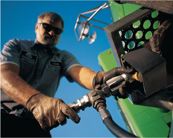 Image of man filling propane tank