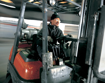Image of worker on forklift